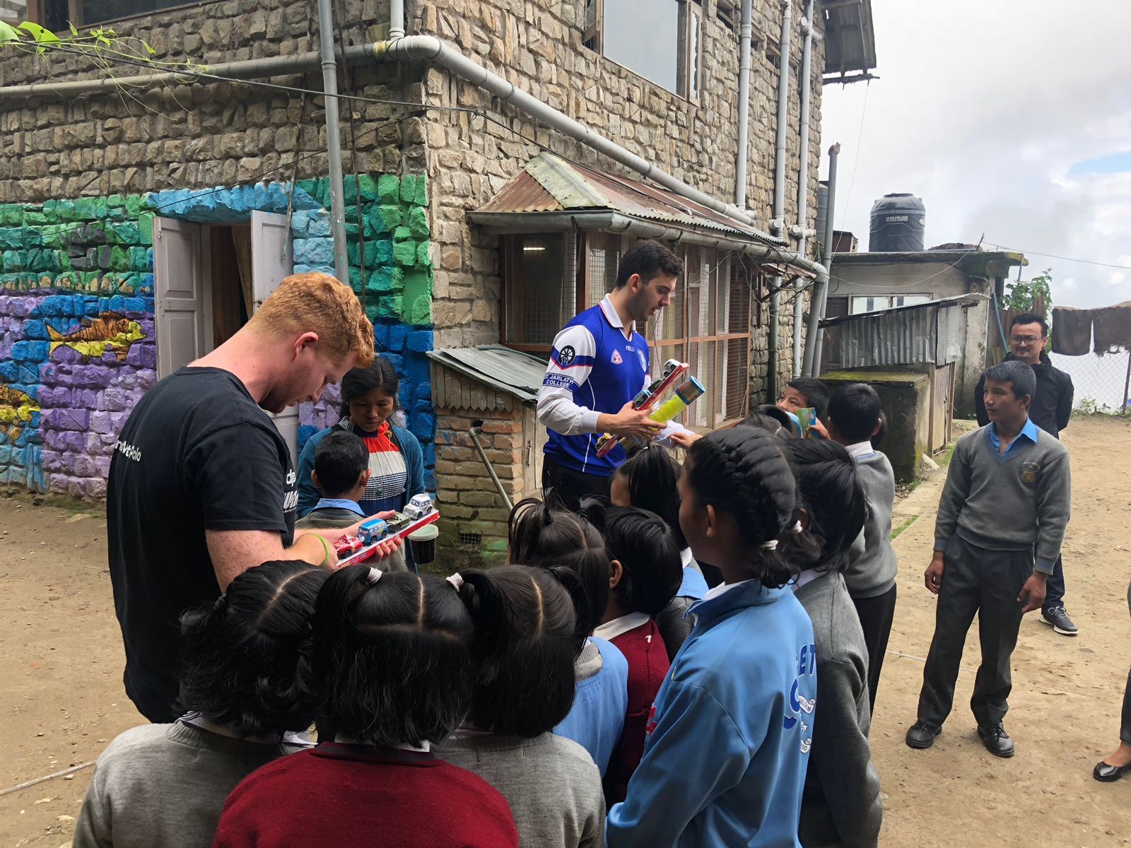 Adam and Michael distribute the toys