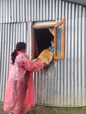 This image has an empty alt attribute; its file name is Relief-from-Covid-through-the-window-of-a-slum-dwelling-in-Darjeeling-India-1-300x400.jpg